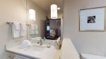 Tertiary en-suite bathroom with granite sink counter tops